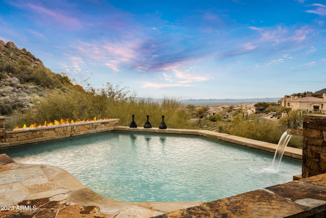 view of pool featuring pool water feature