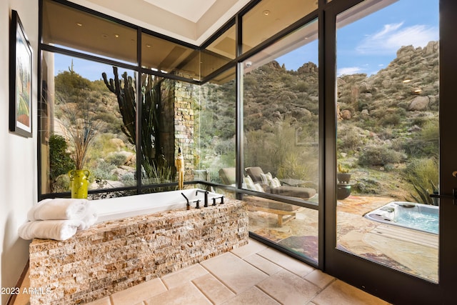 unfurnished sunroom with plenty of natural light