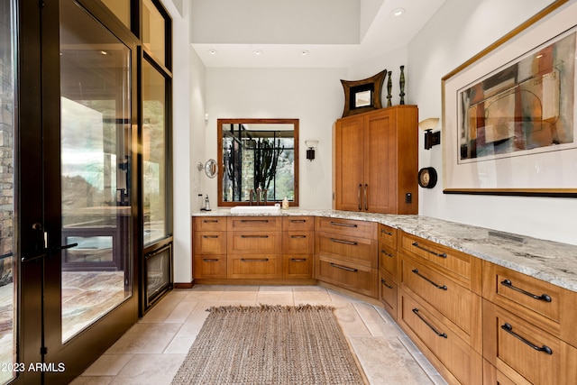 bathroom featuring vanity and tile floors