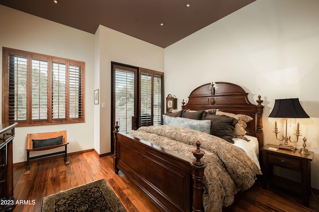 bedroom featuring hardwood / wood-style flooring and access to exterior