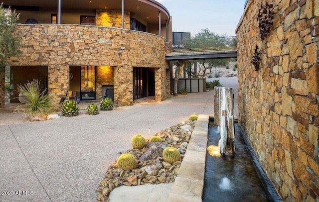 view of side of property featuring a balcony