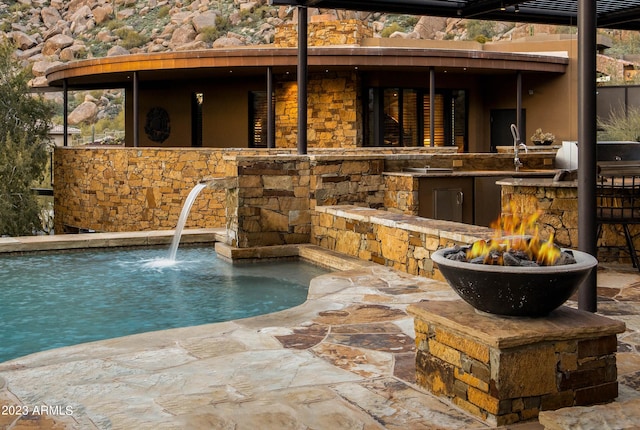 view of pool featuring pool water feature