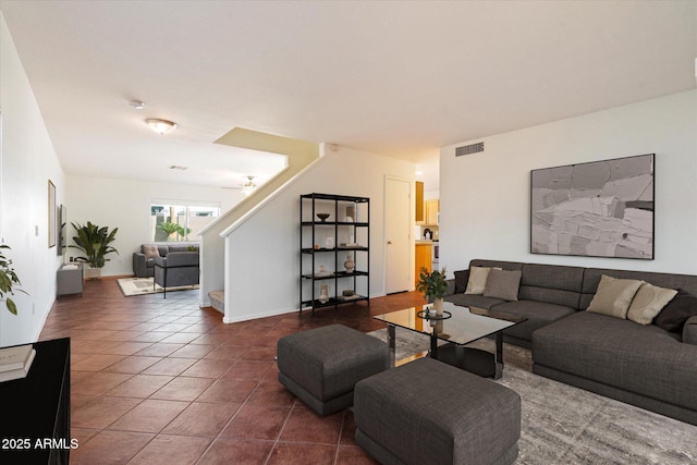 living room featuring dark tile patterned flooring