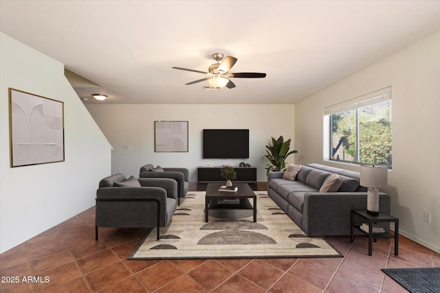 tiled living room featuring ceiling fan