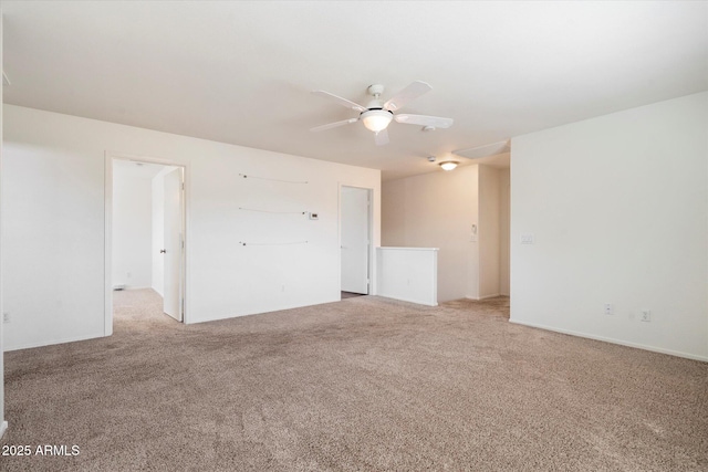 unfurnished room featuring ceiling fan and carpet floors