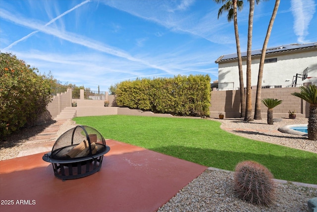 view of yard featuring a patio area and a fire pit