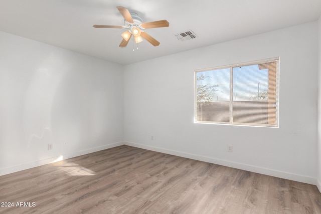 spare room featuring ceiling fan and light hardwood / wood-style floors