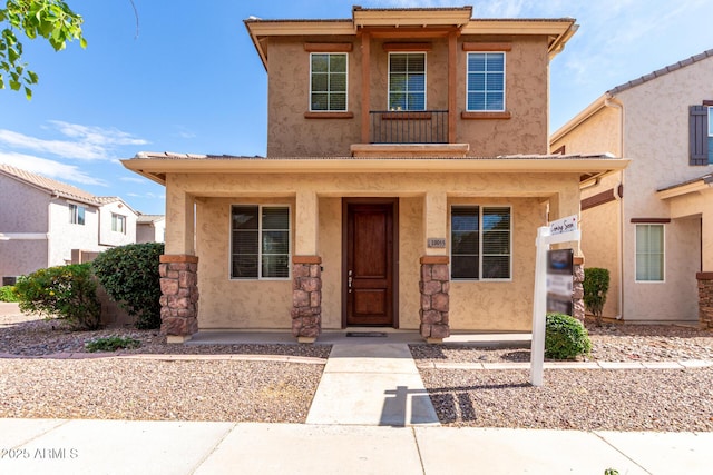 view of front of property with covered porch and stucco siding