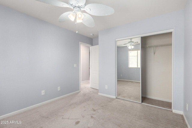 unfurnished bedroom featuring carpet flooring, a closet, ceiling fan, and baseboards
