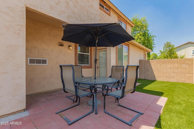 10055 E Isabella Ave, Mesa, AZ 85209 - view of patio / terrace featuring fence and outdoor dining area