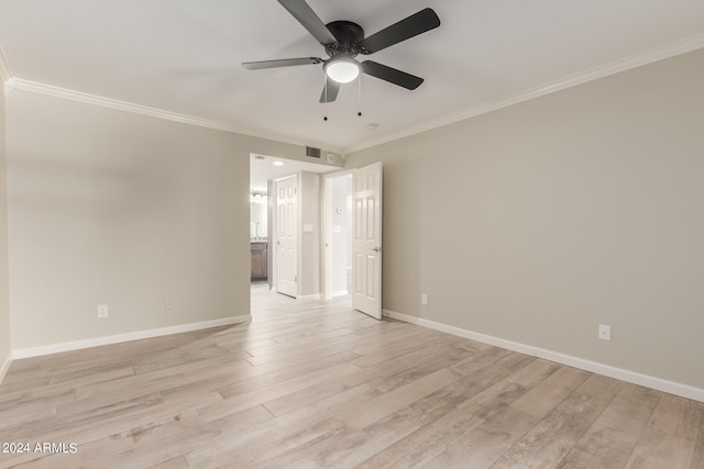 spare room with light hardwood / wood-style flooring, ceiling fan, and ornamental molding