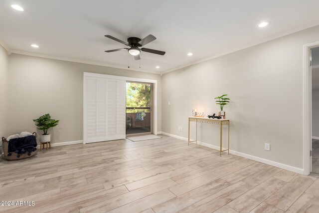 unfurnished room with ornamental molding, light wood-type flooring, and ceiling fan