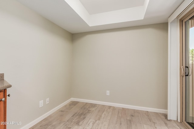 spare room with light hardwood / wood-style flooring