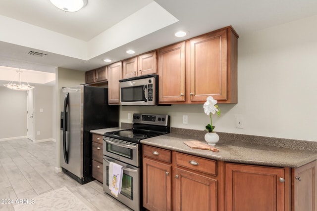 kitchen featuring stainless steel appliances and light wood-type flooring