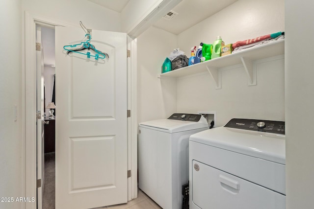 1617 W Pima Ct, Coolidge, AZ 85128 - washroom with washer and clothes dryer and light tile patterned flooring