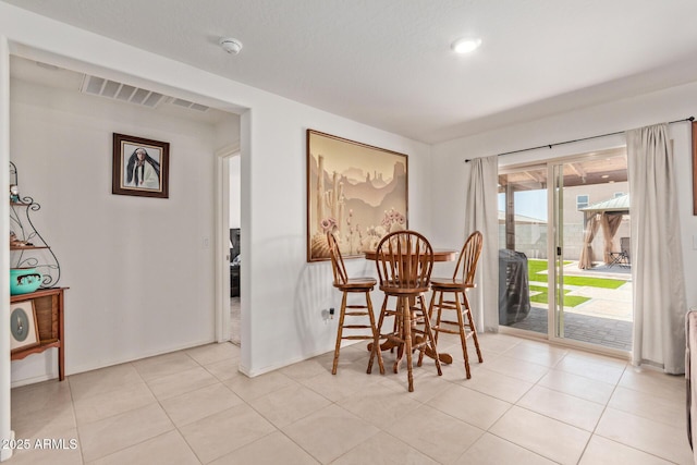 1617 W Pima Ct, Coolidge, AZ 85128 - dining area with baseboards and light tile patterned floors