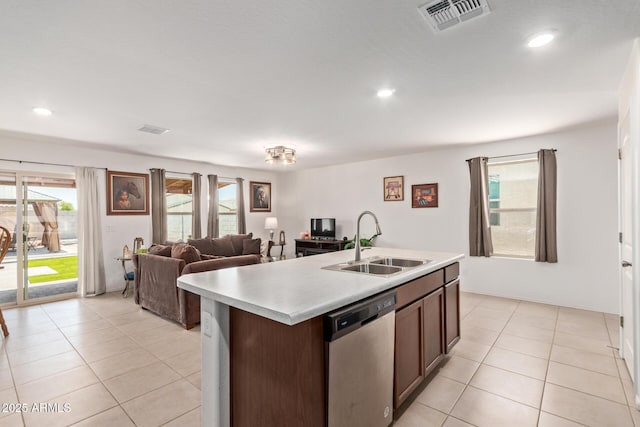 1617 W Pima Ct, Coolidge, AZ 85128 - kitchen featuring dishwasher, light countertops, a center island with sink, light tile patterned flooring, and recessed lighting