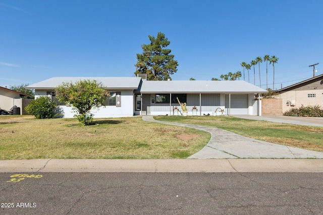 2740 N 21st Dr, Phoenix, AZ 85009 - single story home with an attached garage, driveway, and a front yard