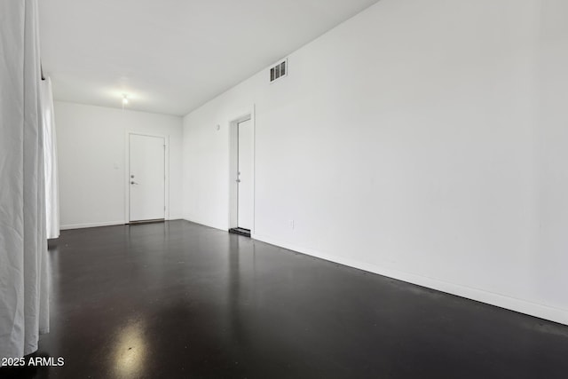 2740 N 21st Dr, Phoenix, AZ 85009 - spare room featuring baseboards, visible vents, and concrete floors