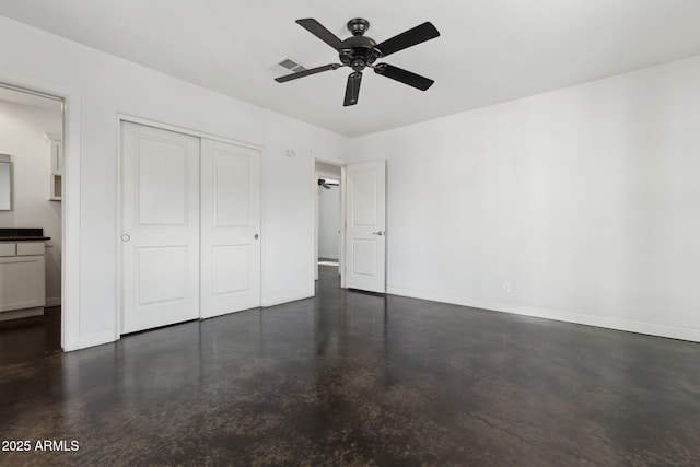 2740 N 21st Dr, Phoenix, AZ 85009 - unfurnished bedroom with baseboards, a closet, finished concrete flooring, visible vents, and ceiling fan