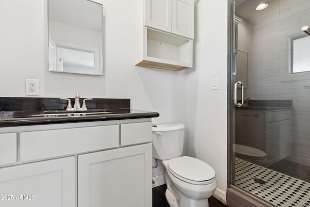 2740 N 21st Dr, Phoenix, AZ 85009 - full bathroom with a shower stall, vanity, and toilet