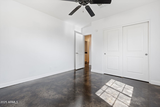 2740 N 21st Dr, Phoenix, AZ 85009 - unfurnished bedroom featuring a closet, concrete floors, baseboards, and ceiling fan