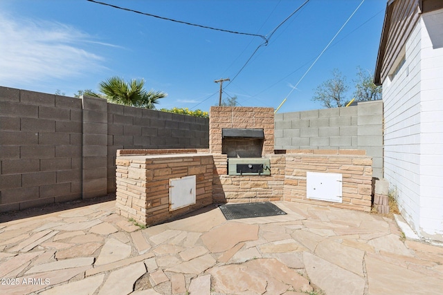 2740 N 21st Dr, Phoenix, AZ 85009 - view of patio with fence and exterior kitchen