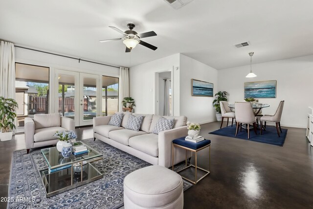 2740 N 21st Dr, Phoenix, AZ 85009 - living area with french doors, concrete floors, a ceiling fan, and visible vents