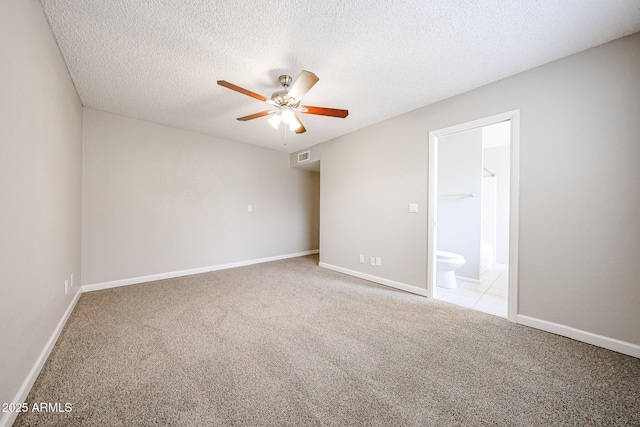 7439 E Ed Rice Ave, Mesa, AZ 85208 - empty room with a ceiling fan, carpet flooring, a textured ceiling, and baseboards