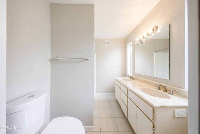 7439 E Ed Rice Ave, Mesa, AZ 85208 - full bathroom with tile patterned floors, double vanity, toilet, and baseboards