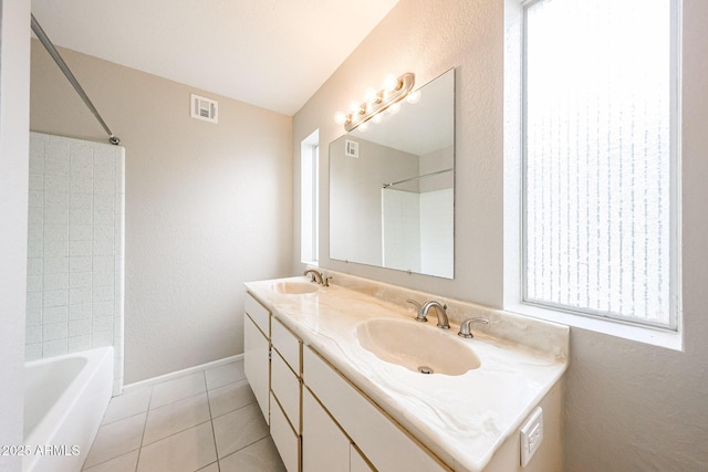 7439 E Ed Rice Ave, Mesa, AZ 85208 - full bath featuring double vanity, tile patterned floors, shower / bathtub combination, a textured wall, and baseboards