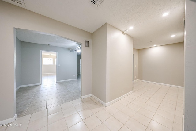 7439 E Ed Rice Ave, Mesa, AZ 85208 - empty room featuring recessed lighting, light tile patterned floors, ceiling fan, a textured ceiling, and baseboards