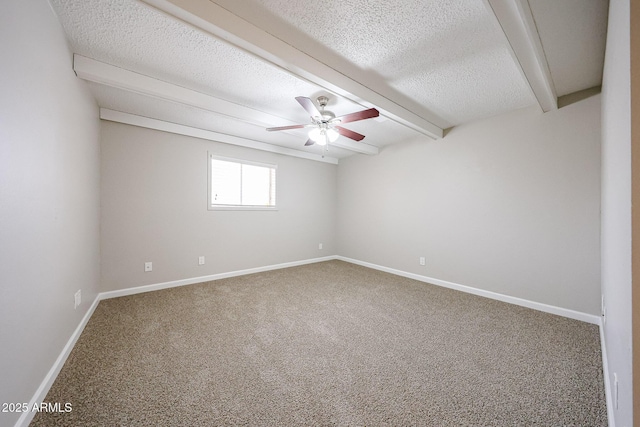 7439 E Ed Rice Ave, Mesa, AZ 85208 - spare room with carpet flooring, a ceiling fan, a textured ceiling, beam ceiling, and baseboards