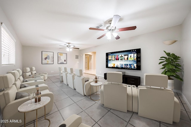 7439 E Ed Rice Ave, Mesa, AZ 85208 - living area featuring a ceiling fan, light tile patterned flooring, baseboards, and arched walkways