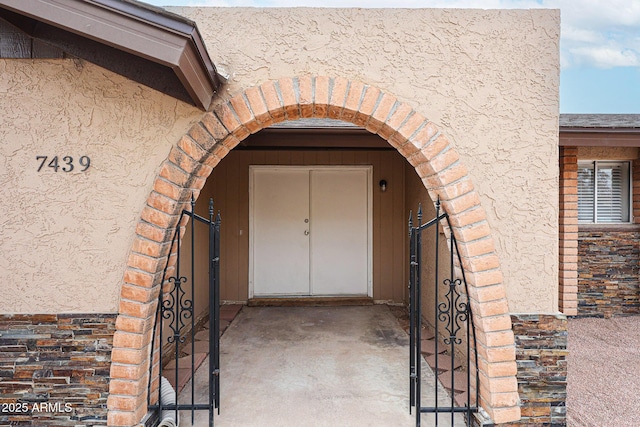 7439 E Ed Rice Ave, Mesa, AZ 85208 - view of exterior entry featuring stucco siding and brick siding