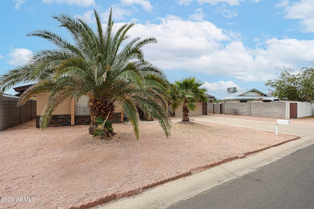 7439 E Ed Rice Ave, Mesa, AZ 85208 - view of front of house featuring driveway, an attached garage, and stucco siding