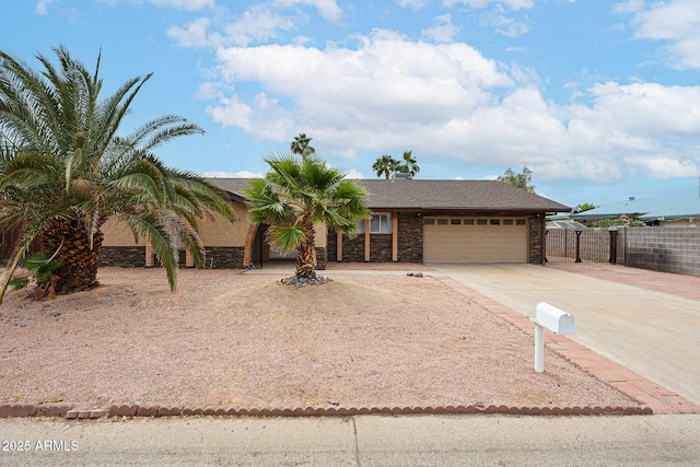 7439 E Ed Rice Ave, Mesa, AZ 85208 - view of front of home with an attached garage, driveway, and stone siding