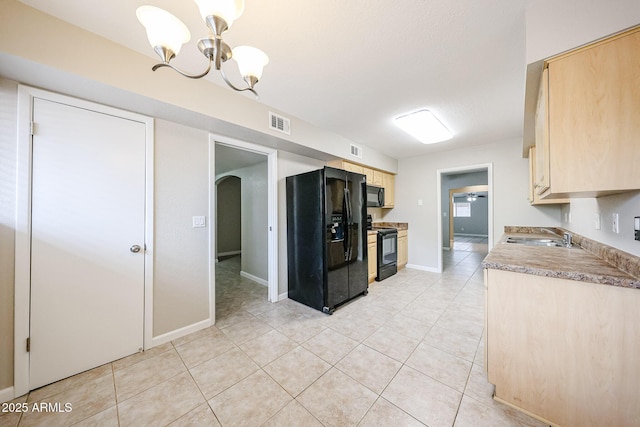 7439 E Ed Rice Ave, Mesa, AZ 85208 - kitchen featuring black appliances, light brown cabinetry, a sink, a chandelier, and light tile patterned floors