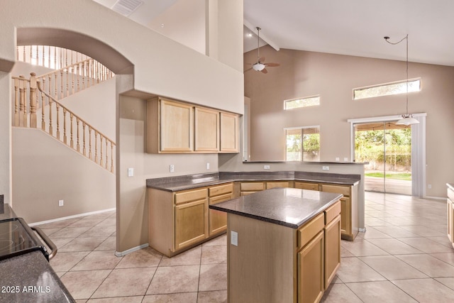 21373 N 94th Ave, Peoria, AZ 85382 - kitchen with dark countertops, ceiling fan, high vaulted ceiling, beamed ceiling, and visible vents