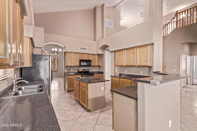 21373 N 94th Ave, Peoria, AZ 85382 - kitchen with black microwave, a sink, stainless steel range with electric stovetop, high vaulted ceiling, and light tile patterned floors