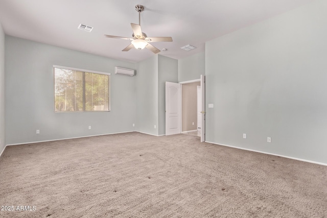 21373 N 94th Ave, Peoria, AZ 85382 - carpeted spare room featuring baseboards, a wall mounted AC, a ceiling fan, and visible vents