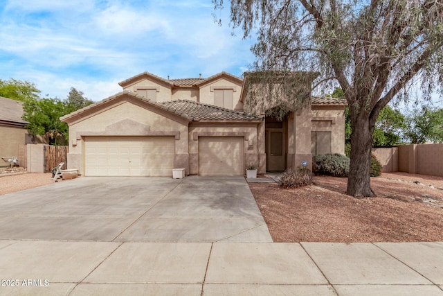 21373 N 94th Ave, Peoria, AZ 85382 - mediterranean / spanish-style house featuring fence, a garage, stucco siding, concrete driveway, and a tiled roof