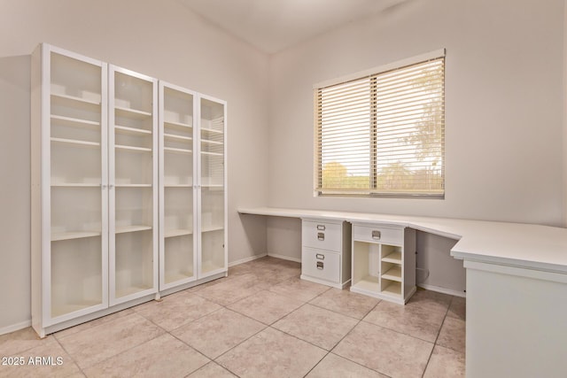 21373 N 94th Ave, Peoria, AZ 85382 - unfurnished office with light tile patterned floors, baseboards, and built in desk
