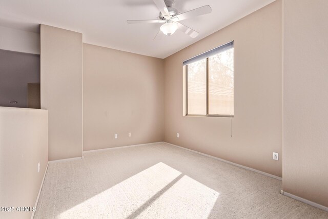 21373 N 94th Ave, Peoria, AZ 85382 - spare room with carpet floors, ceiling fan, and baseboards