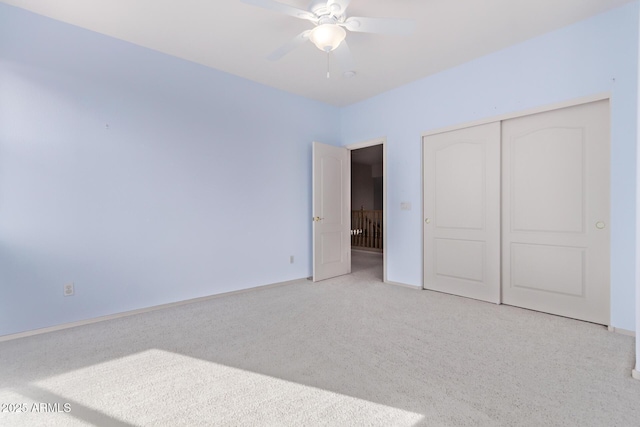 21373 N 94th Ave, Peoria, AZ 85382 - unfurnished bedroom featuring baseboards, light carpet, ceiling fan, and a closet
