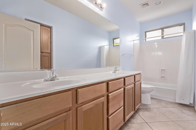 21373 N 94th Ave, Peoria, AZ 85382 - bathroom featuring toilet, visible vents, a sink, and tile patterned flooring