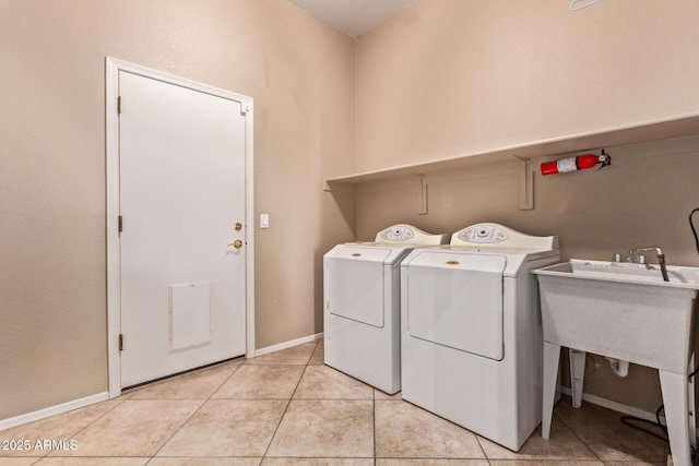 21373 N 94th Ave, Peoria, AZ 85382 - laundry area with independent washer and dryer, laundry area, baseboards, and light tile patterned floors