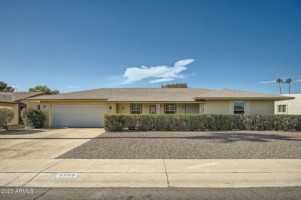 single story home featuring a garage