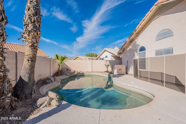 view of swimming pool with a fenced backyard and a fenced in pool