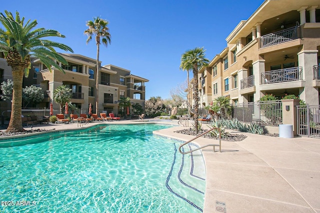 7601 E Indian Bend Rd Unit 3030, Scottsdale, AZ 85250 - community pool featuring a ceiling fan and a patio